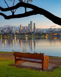 Park bench overlooking the city skyline